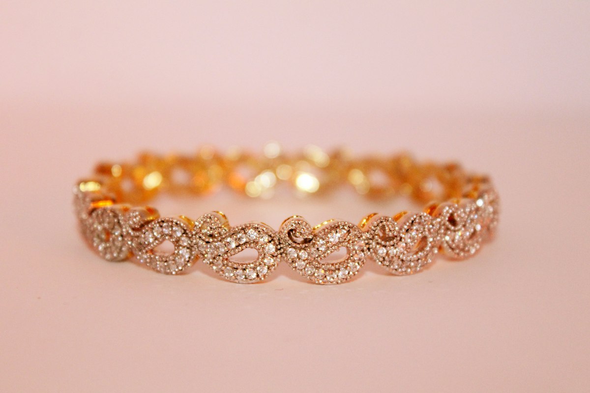 Gold bangles side by side, showing the colour difference between karats